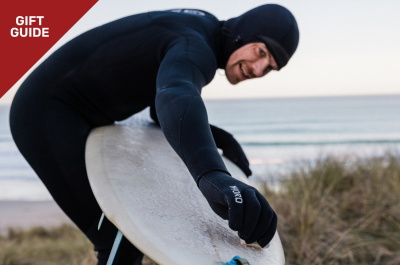 Wetsuit accessories laid out as gift ideas for surfers