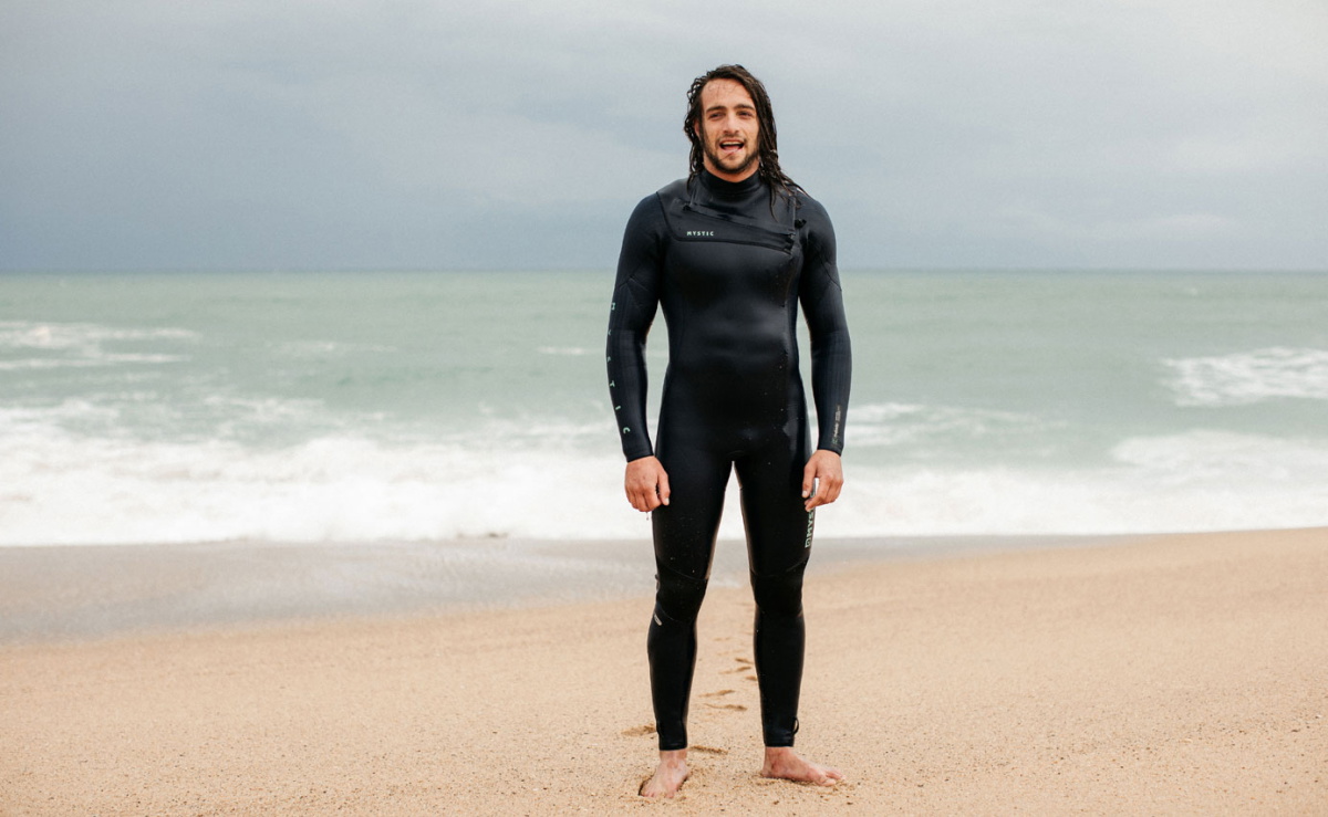 man in mystic majestic wetsuit
