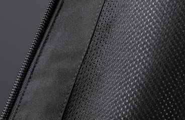 Close-up of the zip and mesh-textured panel on a dark grey technical sailing jacket